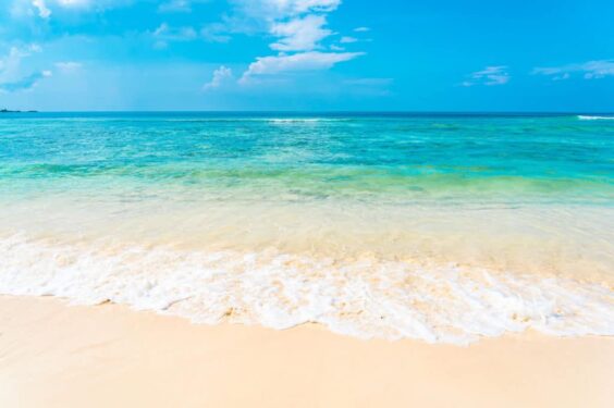 Beautiful Tropical Empty Beach Sea Ocean With White Cloud Blue Sky Background 1024x682