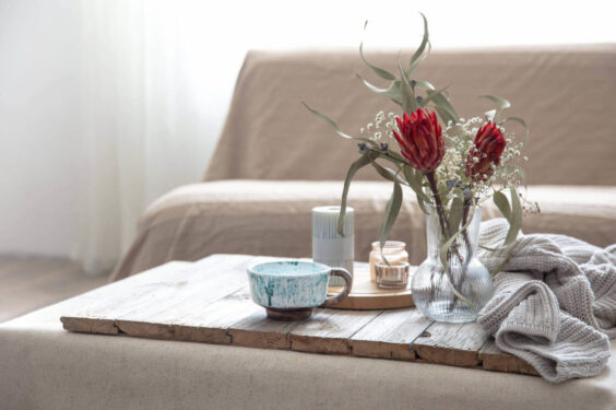 Cup Candles Vase With Protea Flowers Knitted Element Room Blurred Background 2 2 1024x682